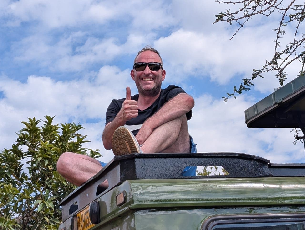 Guest enjoying a private safari vehicle tour on a Rwanda tour package